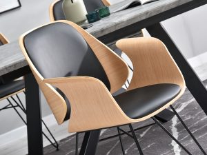 Krzesło SILA łączy w sobie wszystkie najciekawsze elementy - kubełkowe siedzisko, gięte drewno, tapicerowanie skórą ekologiczną oraz metalową podstawę. 
