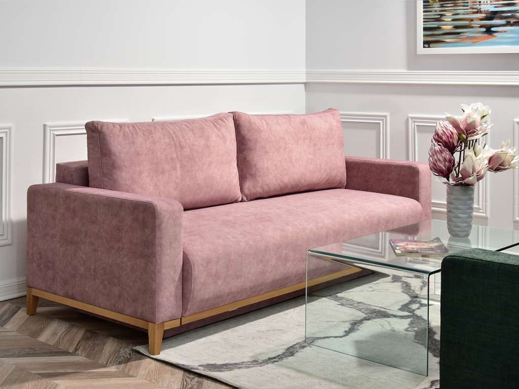 dwie kanapy w salonie różowa kanapa rozkładana z funkcją spania i pojemnikiem na pościel STOCKHOLM pokój dzienny relaks wypoczynek