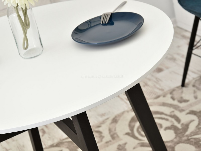 stylowy stół do kuchni CROSS biały okrągły blat czarna drewniana podstawa cztery nogi nowoczesny 